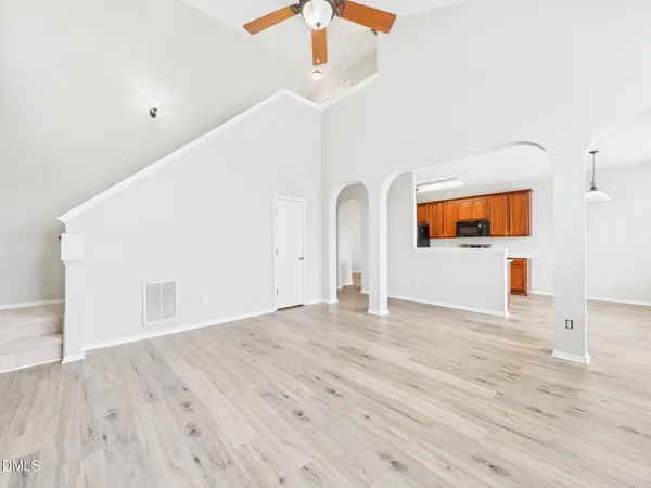 a bathroom with a tub a sink and mirror