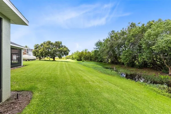a backyard of a house with lots of green space