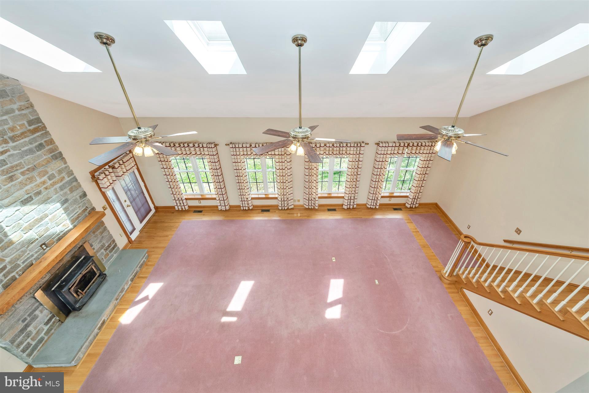6445 New London Road New Market, MD 21774 - Photo 14 of 30 Great Room has Wood Stove & Door to Rear Yard