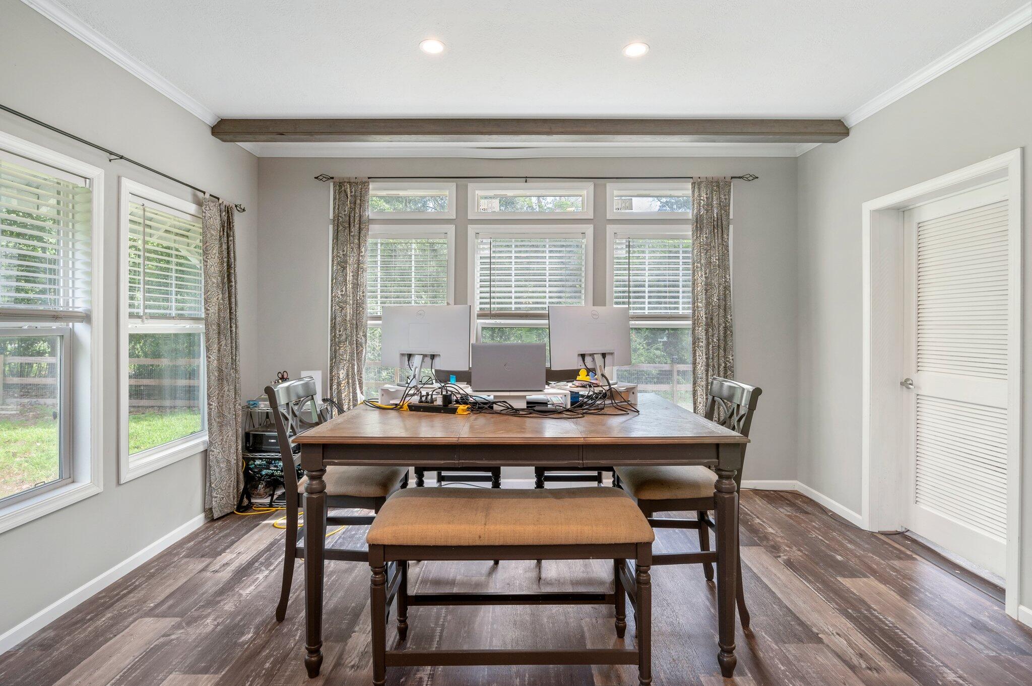 5979 Old River Road Baker, FL 32531 - Photo 17 of 46 a view of a dining room with furniture window and wooden floor