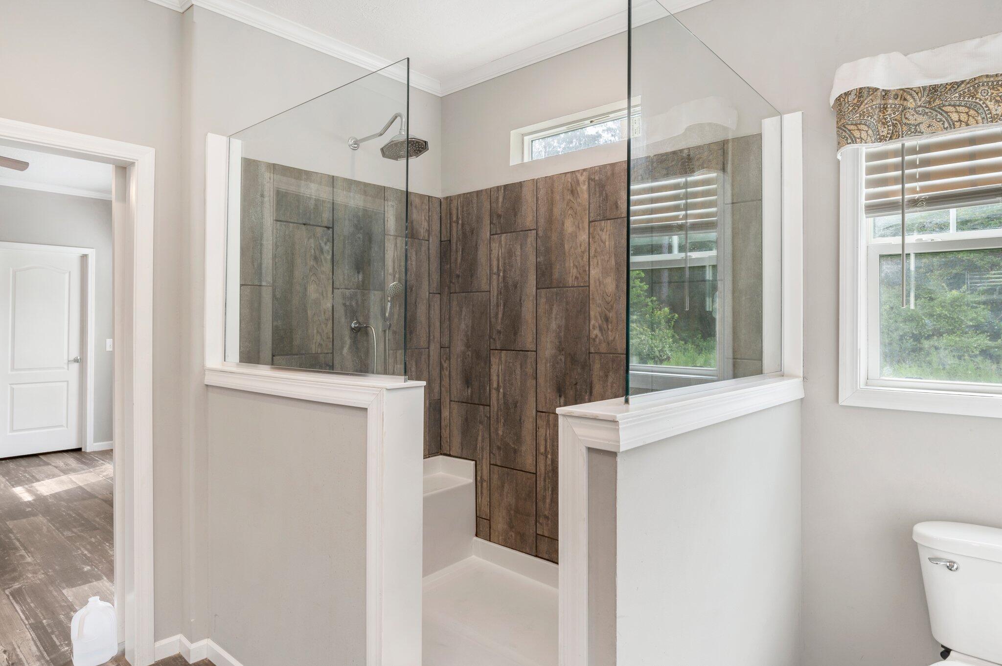 5979 Old River Road Baker, FL 32531 - Photo 22 of 46 a bathroom with a shower and a toilet