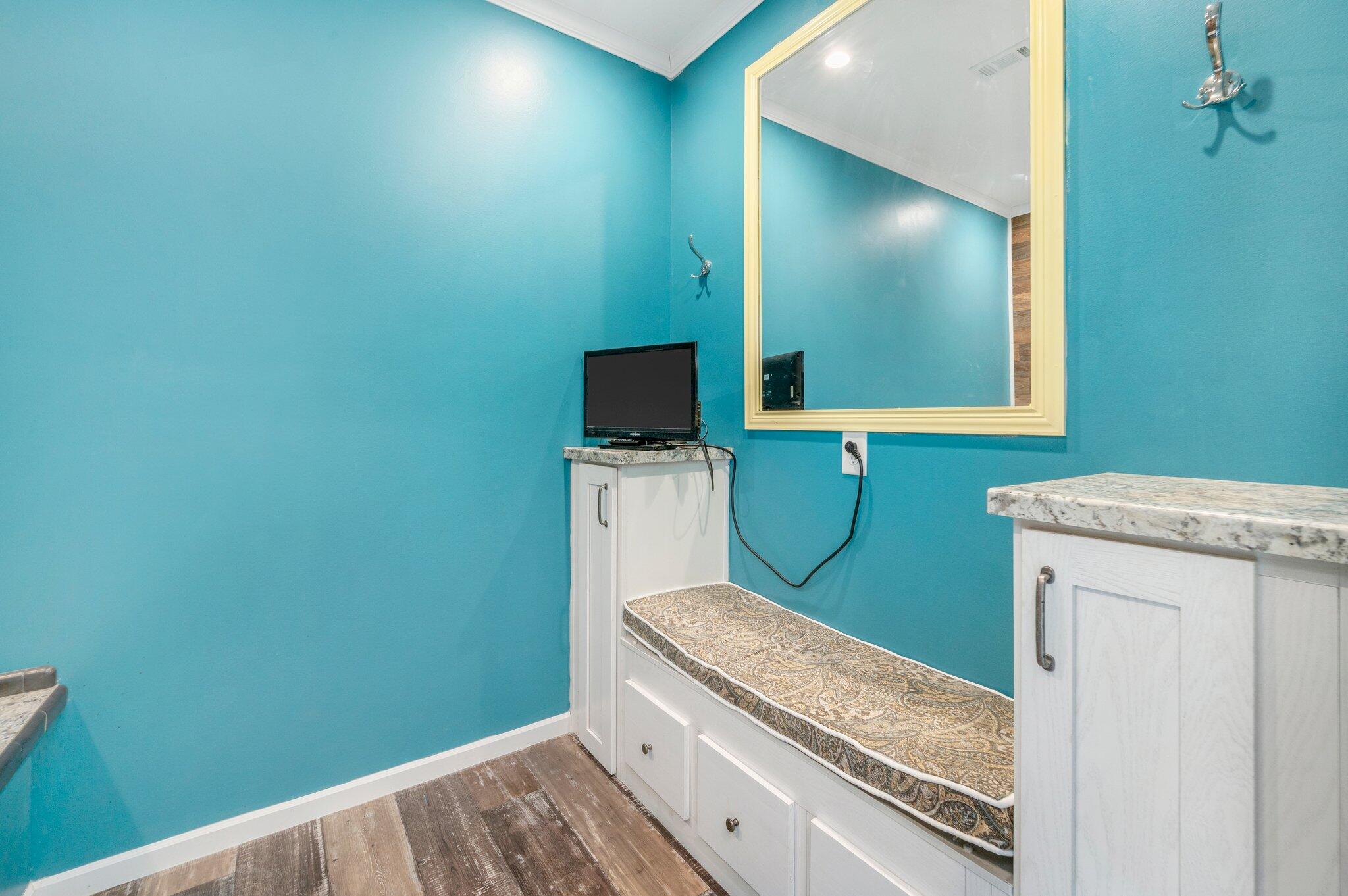 5979 Old River Road Baker, FL 32531 - Photo 25 of 46 a bathroom with a granite countertop sink and a mirror