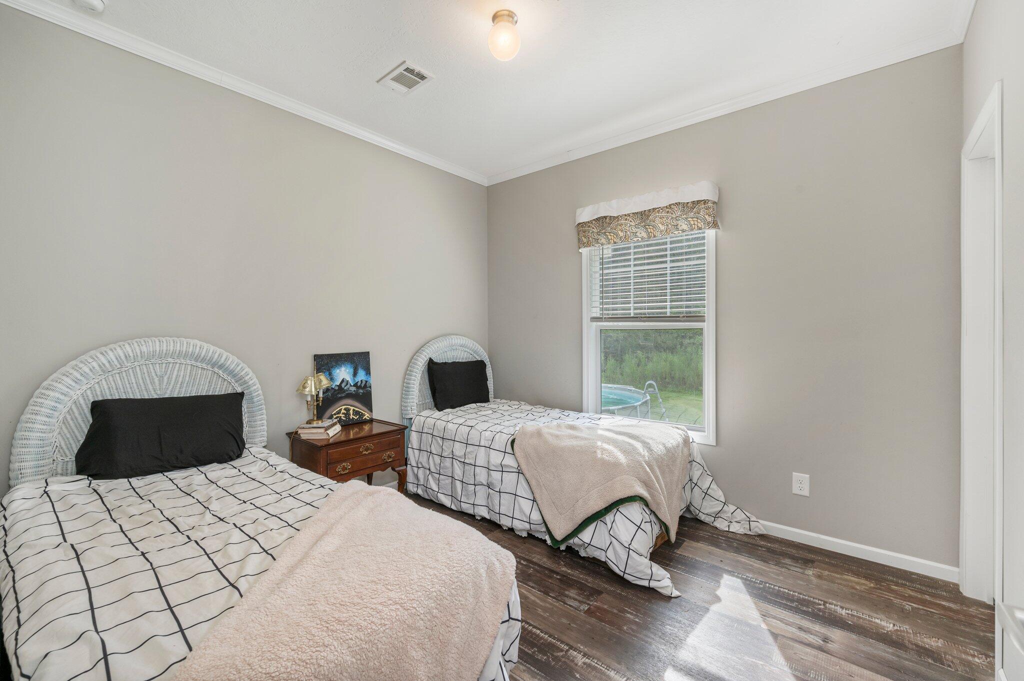 5979 Old River Road Baker, FL 32531 - Photo 29 of 46 a bedroom with two beds and a window