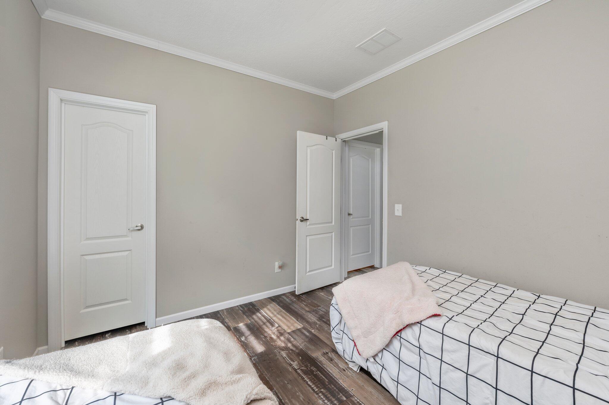 5979 Old River Road Baker, FL 32531 - Photo 30 of 46 a bedroom with a bed and a night stand