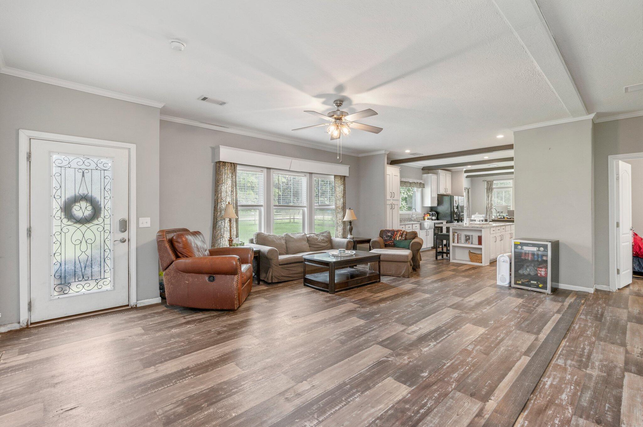5979 Old River Road Baker, FL 32531 - Photo 6 of 46 a living room with furniture and a window