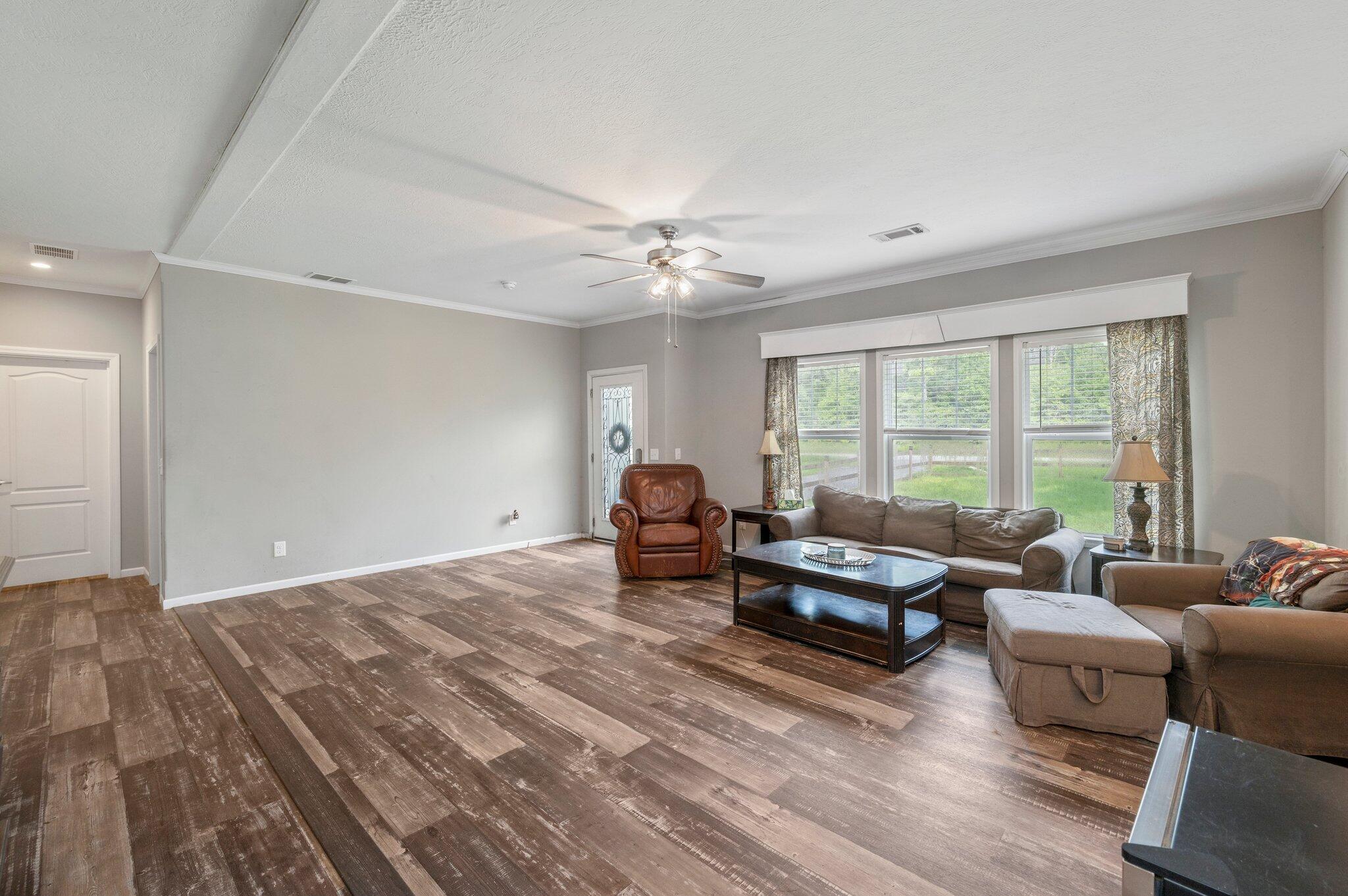5979 Old River Road Baker, FL 32531 - Photo 7 of 46 a living room with furniture and a large window