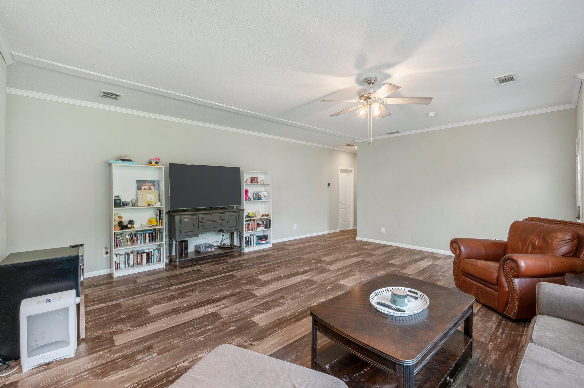 5979 Old River Road Baker, FL 32531 - Photo 8 of 46 a view of a livingroom with furniture and a flat screen tv