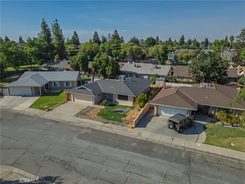749 Junipero Court Merced, CA 95348 - Photo 36 of 57 an aerial view of a house with garden space and street view