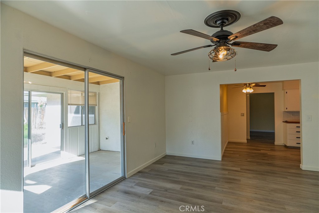 749 Junipero Court Merced, CA 95348 - Photo 8 of 57 wooden floor in an empty room with a window