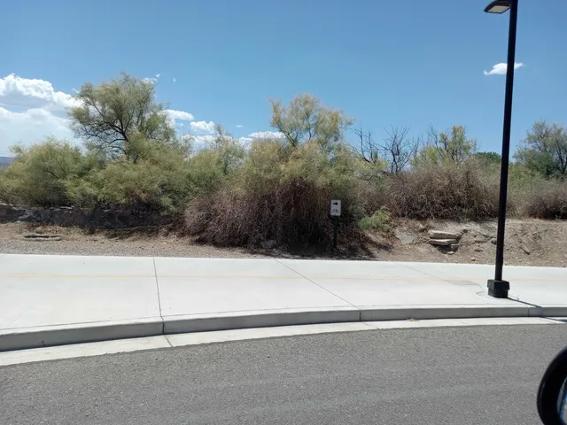 a view of swimming pool with outdoor seating and city view