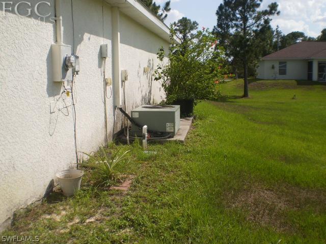 640 Homestead Road South Lehigh Acres, FL 33974 - Photo 20 of 21 a backyard of a house with table and chairs