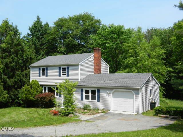 19 Benedict Road Bethel, CT 06801 - Photo 1 of 1 a front view of a house with a garden