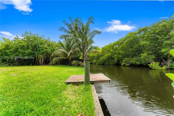 a view of a lake with a yard