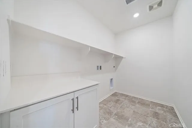 a view of storage and utility room with empty racks