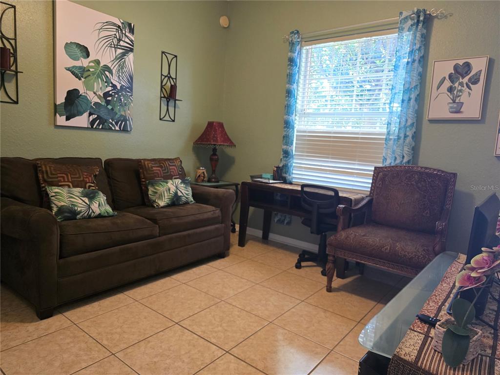 219 Cloverdale Road Winter Haven, FL 33884 - Photo 17 of 29 a living room with furniture and a window