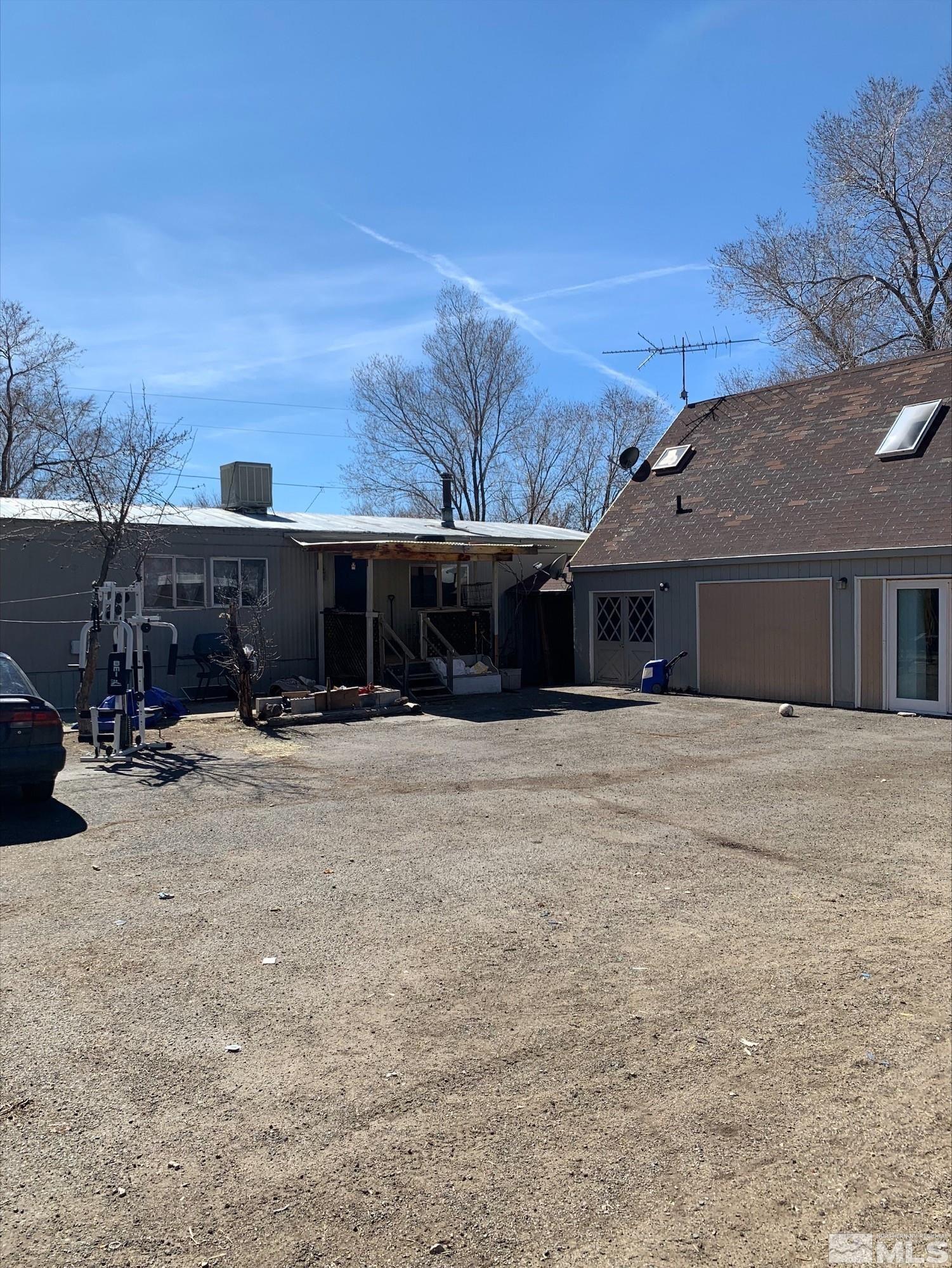 17550 Thrush Lane Reno, NV 89508 - Photo 1 of 4 a front view of a house with a yard and garage