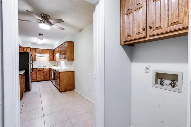 a view of kitchen with cabinets and microwave
