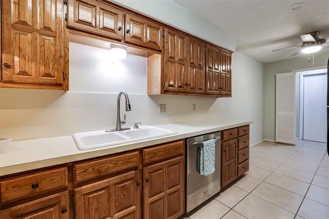 a kitchen with stainless steel appliances granite countertop a sink and a stove