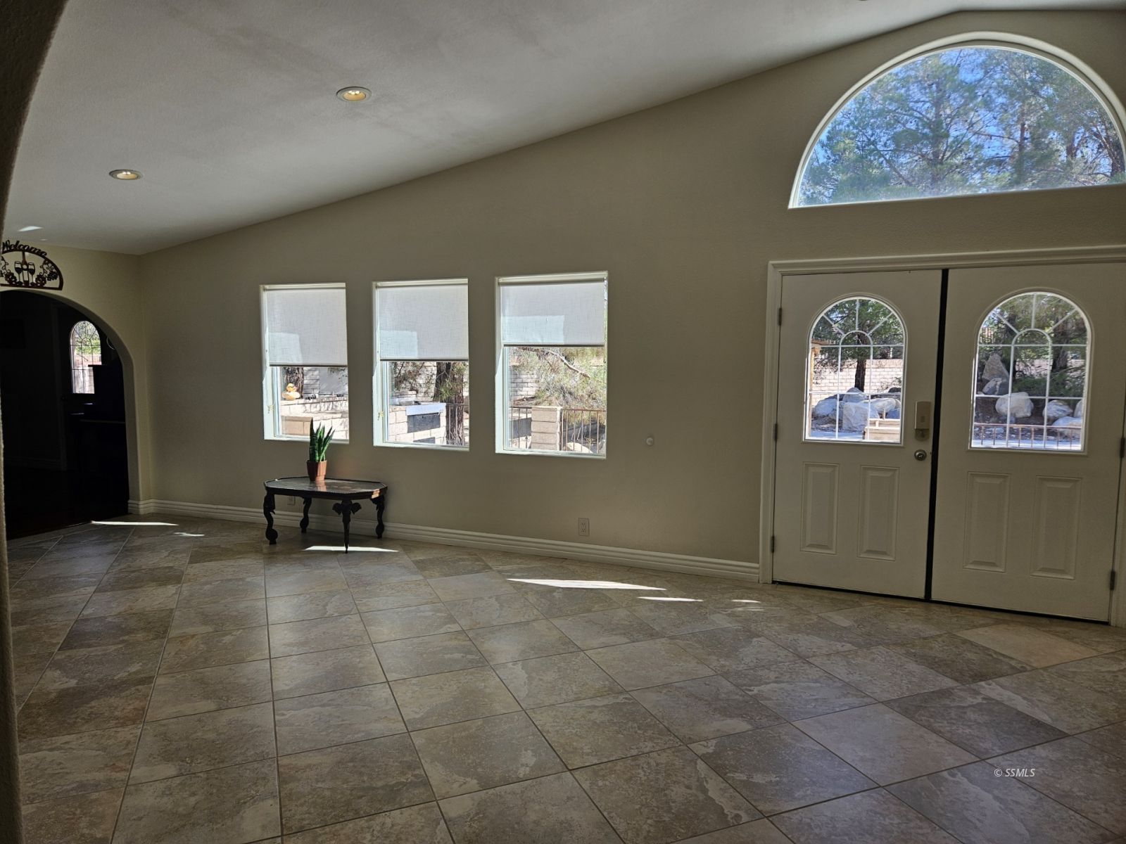 928 North Brady Street Ridgecrest, CA 93555 - Photo 13 of 21 an empty room with windows and ceiling fan