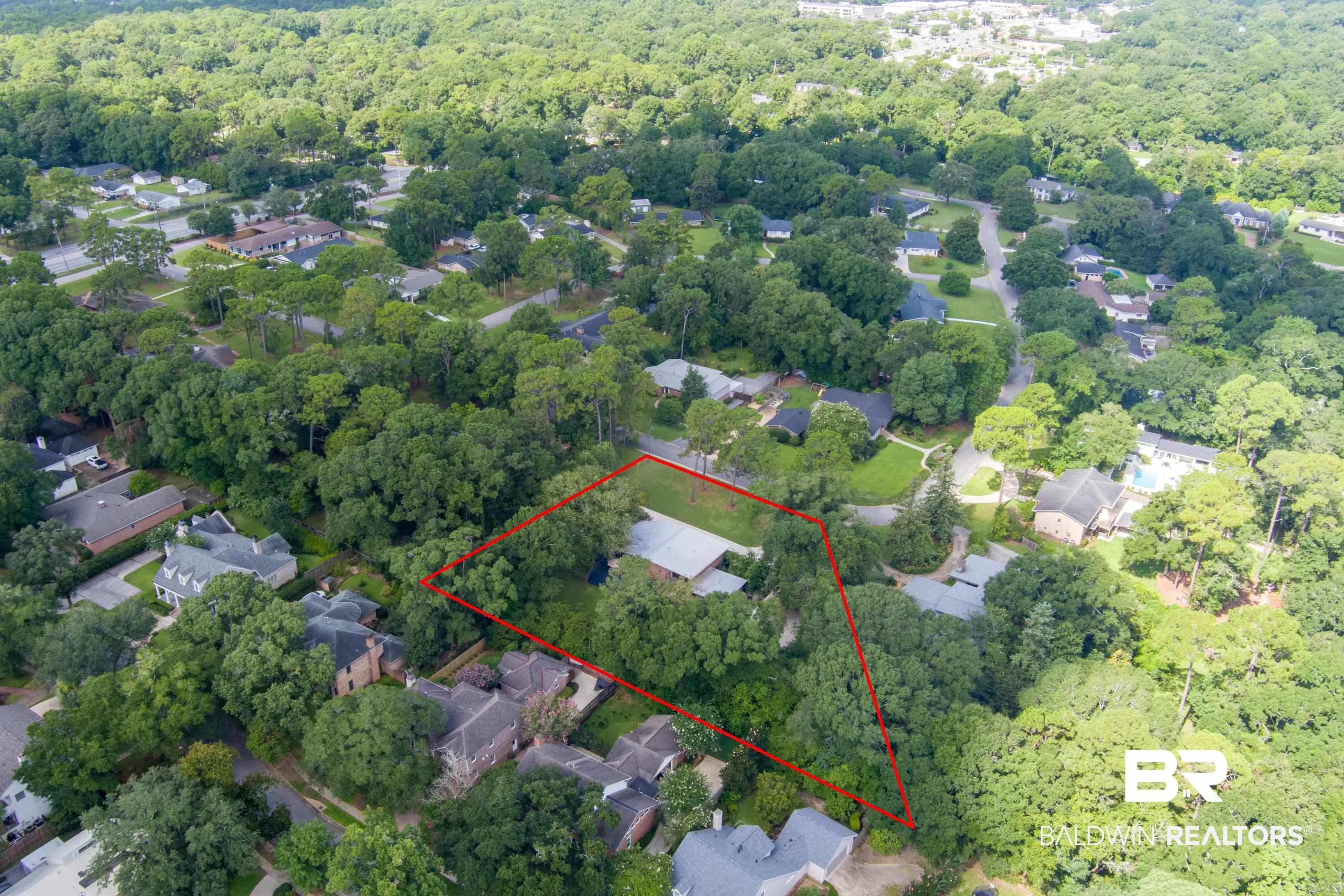 233 Suzanne Circle Mobile, AL 36608 - Photo 73 of 85 Aerial view of residential area featuring property parcel outlined and a heavily wooded area