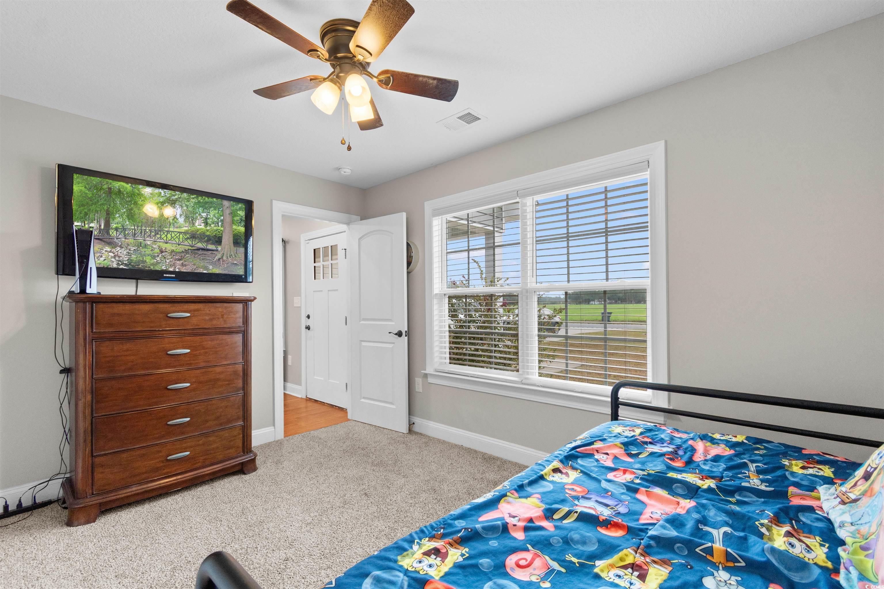 3753 Edwards Road Aynor, SC 29544 - Photo 24 of 38 Bedroom with light carpet and ceiling fan