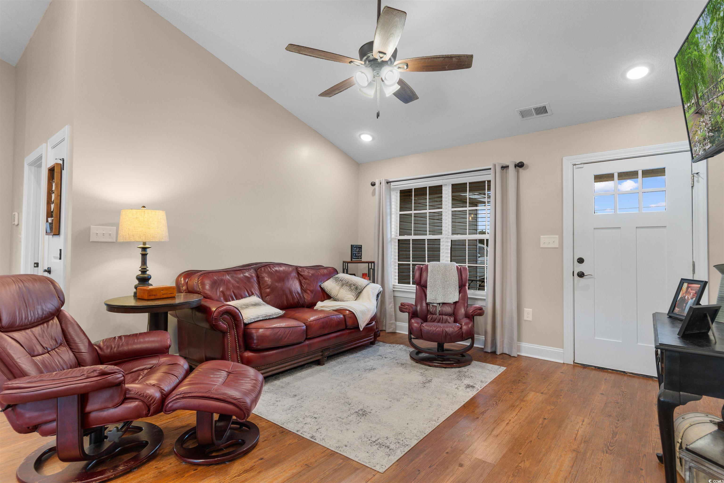 3753 Edwards Road Aynor, SC 29544 - Photo 3 of 38 Living room with wood finished floors, a ceiling fan, high vaulted ceiling, and recessed lighting