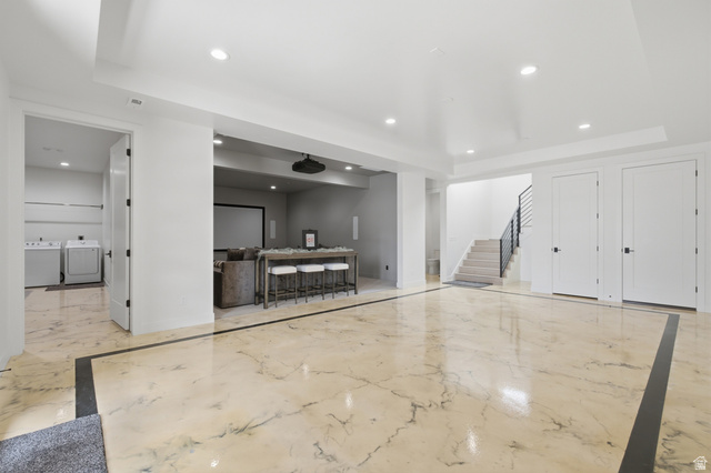 1445 Jacob Road Sandy, UT 84092 - Photo 28 of 52 Expansive polished flooring with contrasting border, recessed lighting, and a dedicated laundry area