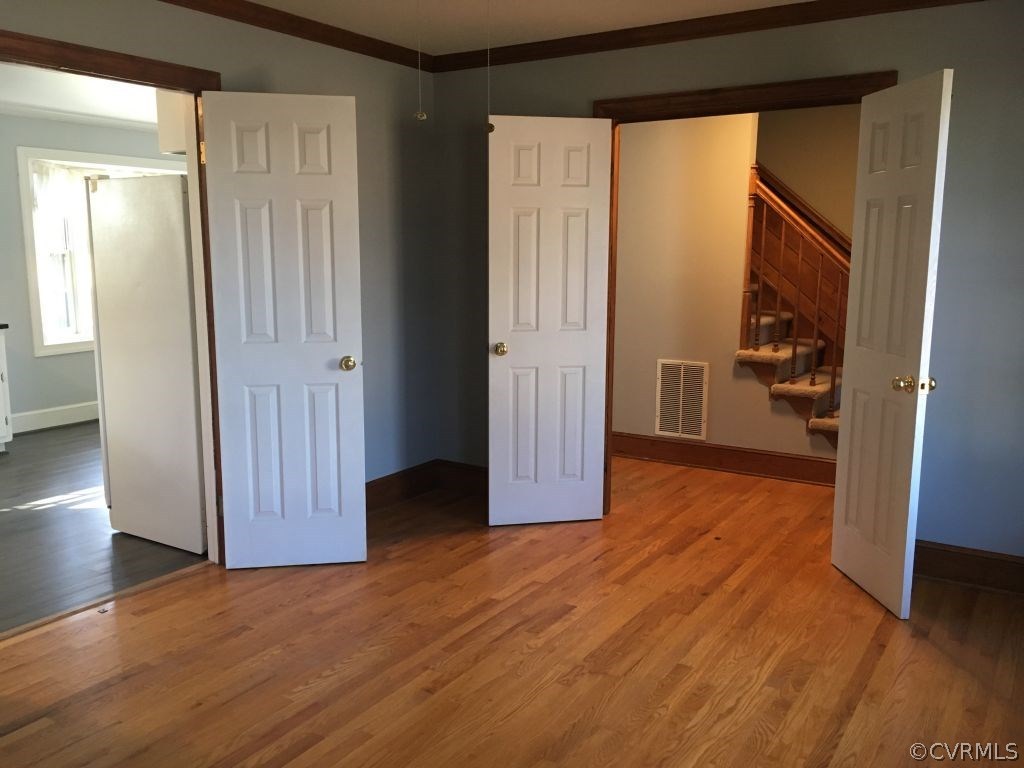3501 Ludgate Road Chester, VA 23831 - Photo 3 of 8 a view of a big room with wooden floor and windows in a room