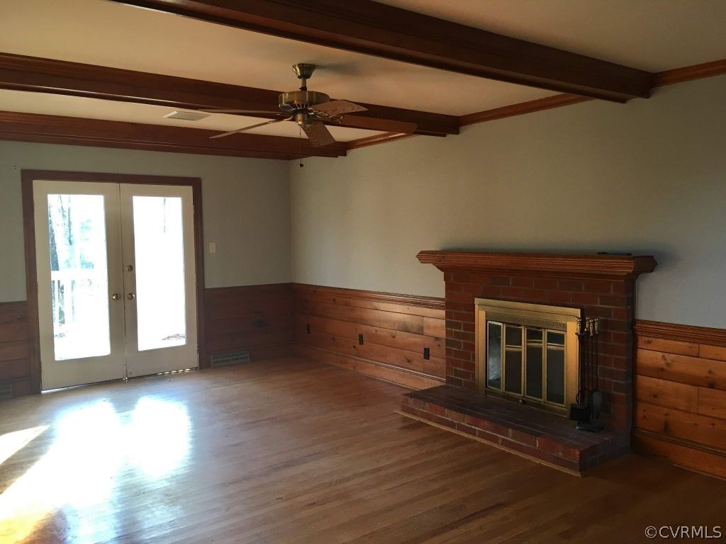 3501 Ludgate Road Chester, VA 23831 - Photo 4 of 8 a view of an empty room with wooden floor and a window