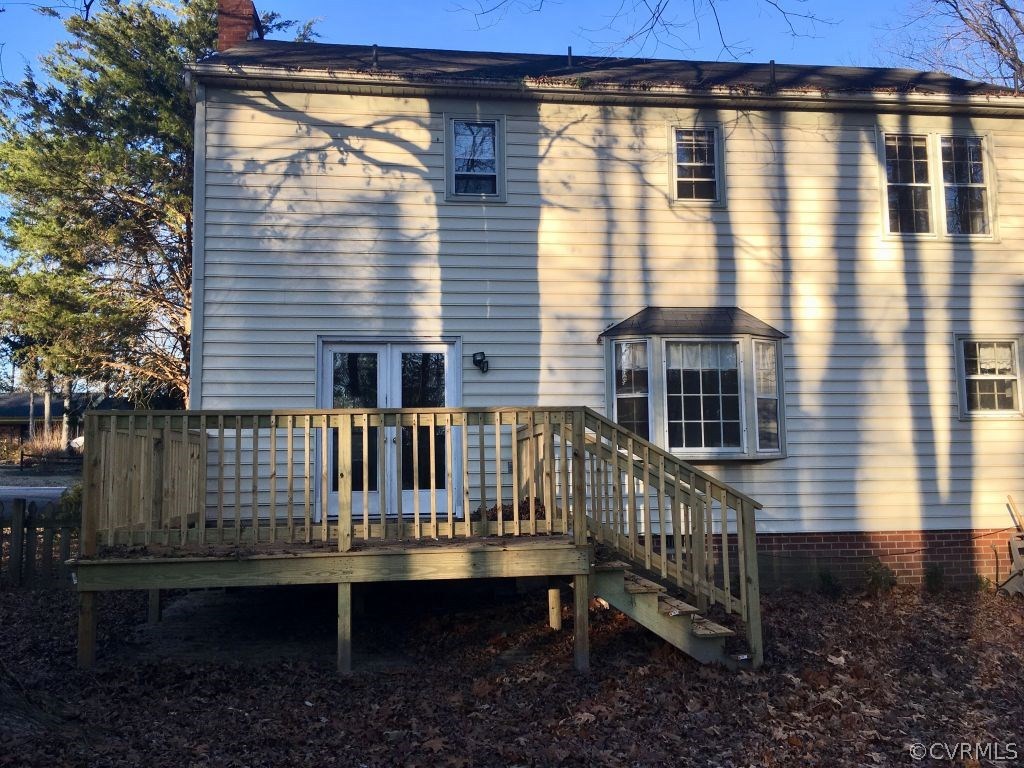 3501 Ludgate Road Chester, VA 23831 - Photo 8 of 8 a view of a house with a wooden deck and furniture