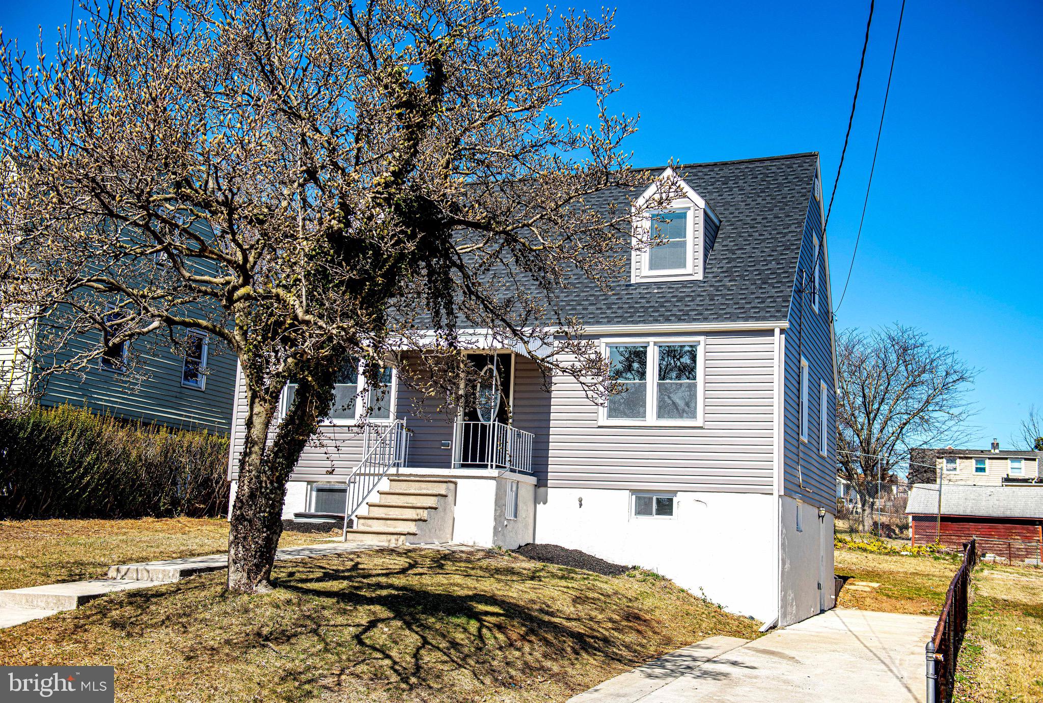 7906 31st Street Rosedale, MD 21237 - Photo 2 of 33 a front view of a house with a yard