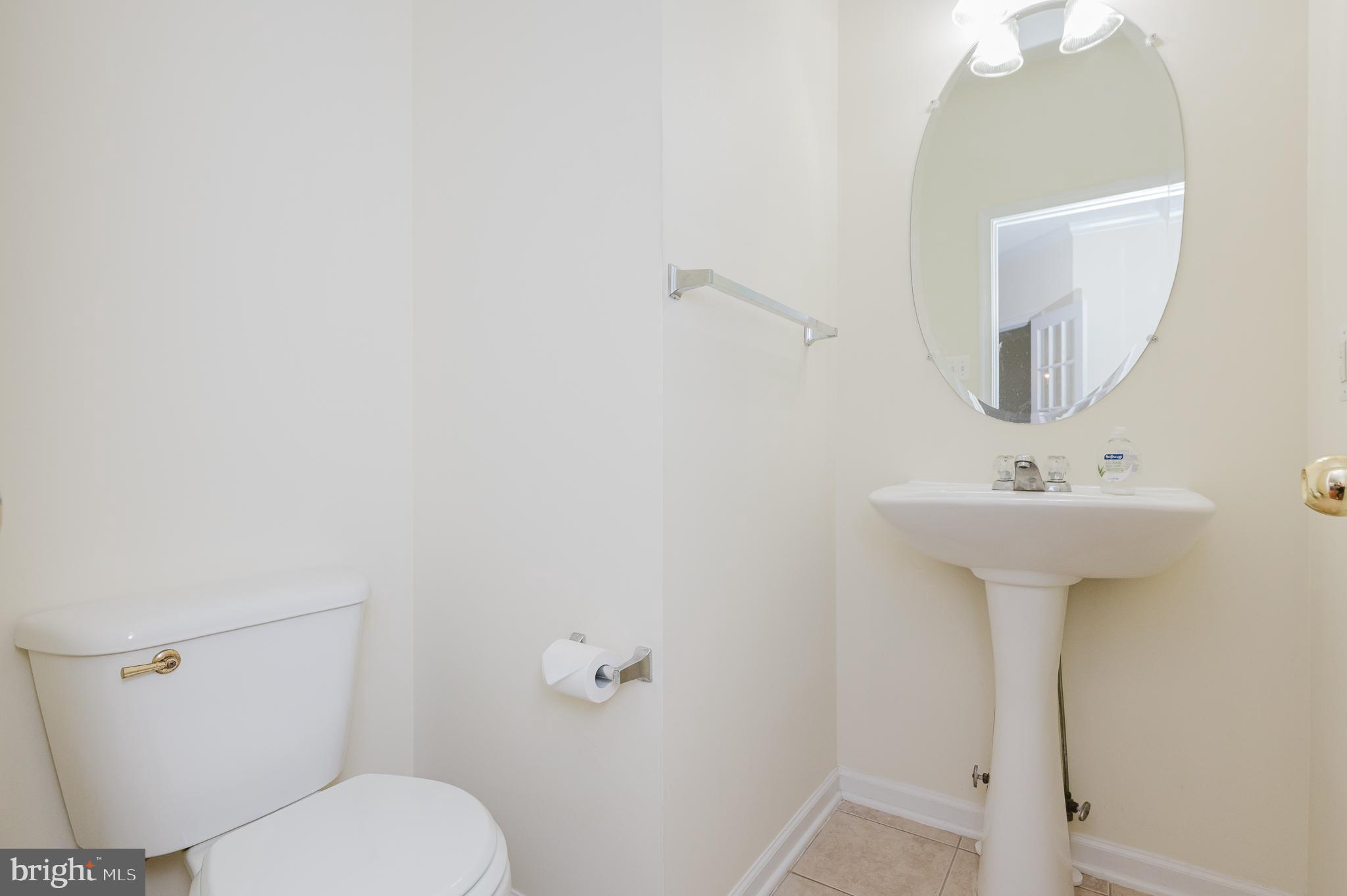 719 MacDill Road Middle River, MD 21220 - Photo 21 of 35 a bathroom with a sink toilet and a mirror