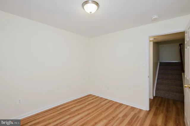 a view of room with wooden floor