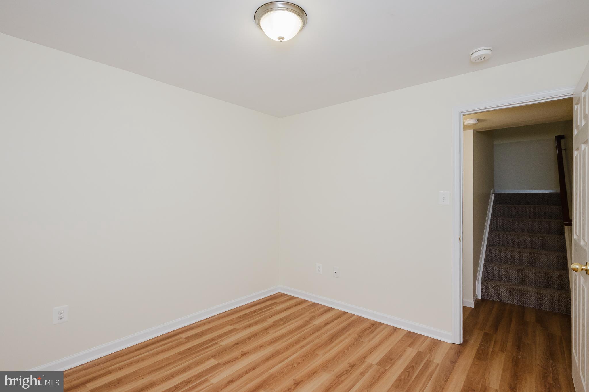 719 MacDill Road Middle River, MD 21220 - Photo 22 of 35 a view of empty room with wooden floor