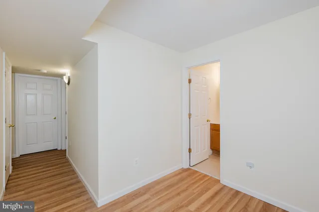 a view of bathroom with a sink and a mirror