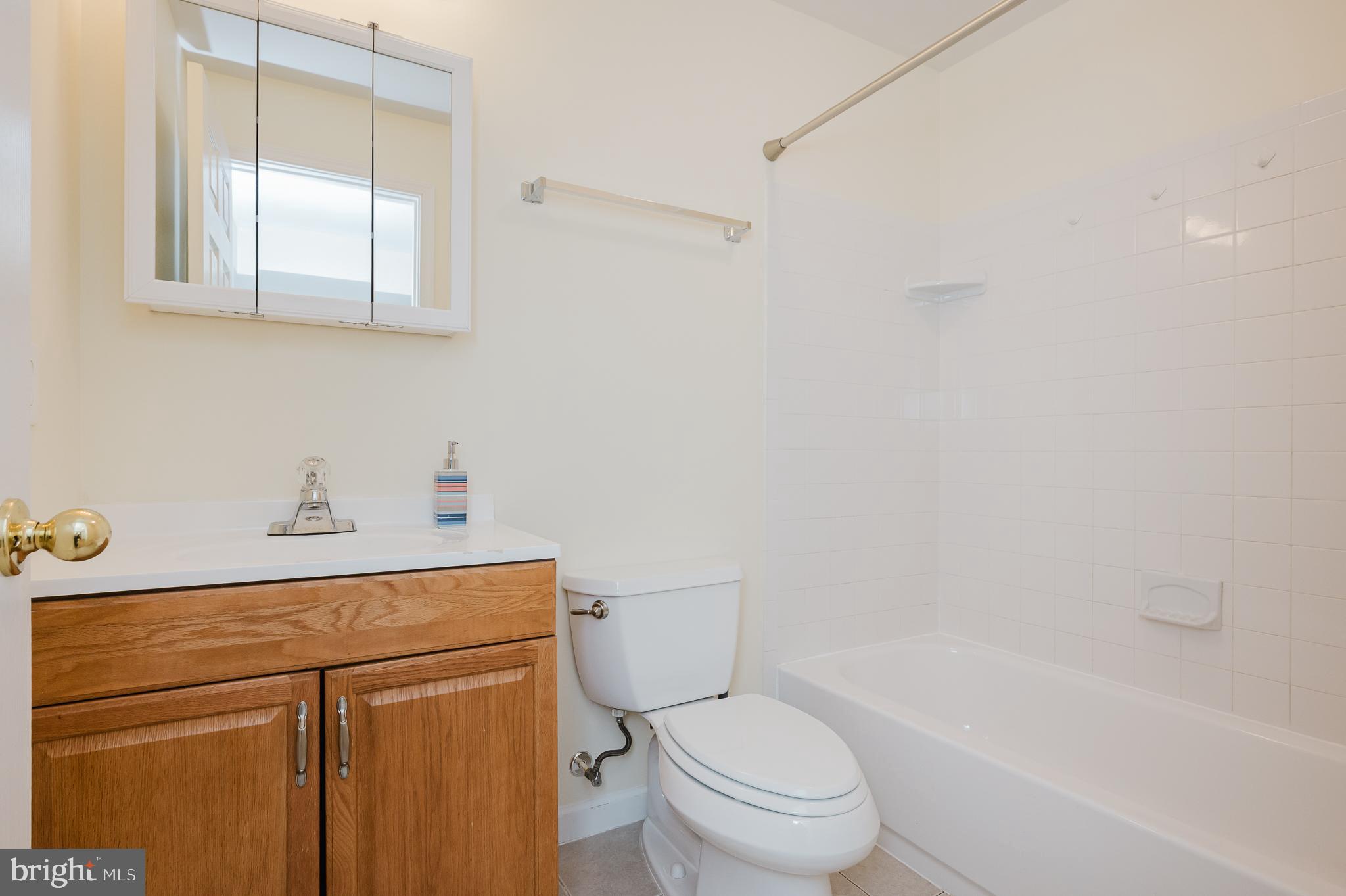 719 MacDill Road Middle River, MD 21220 - Photo 30 of 35 a bathroom with a sink a toilet and shower