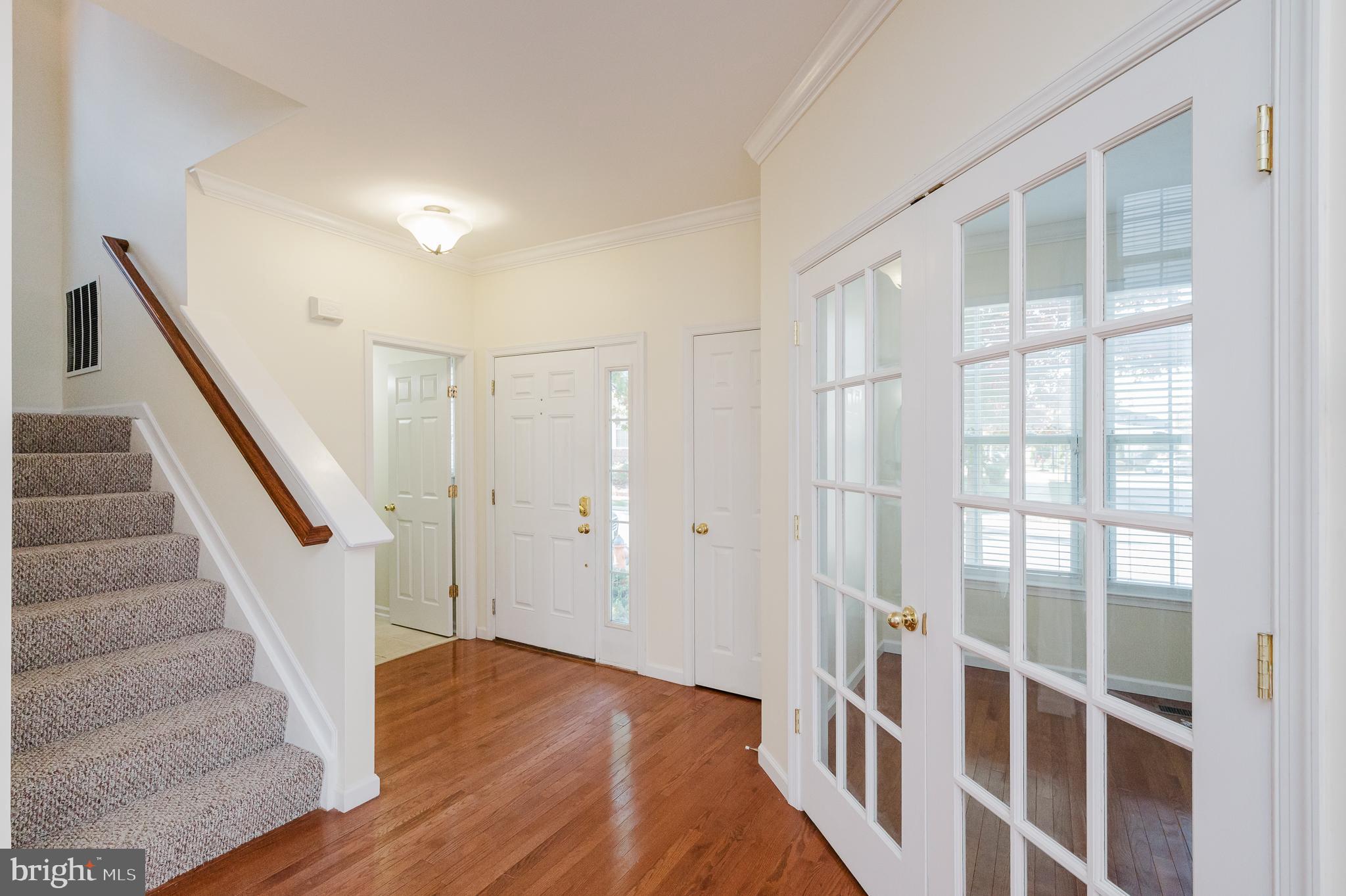 719 MacDill Road Middle River, MD 21220 - Photo 3 of 35 a view of entryway with wooden floor and stairs