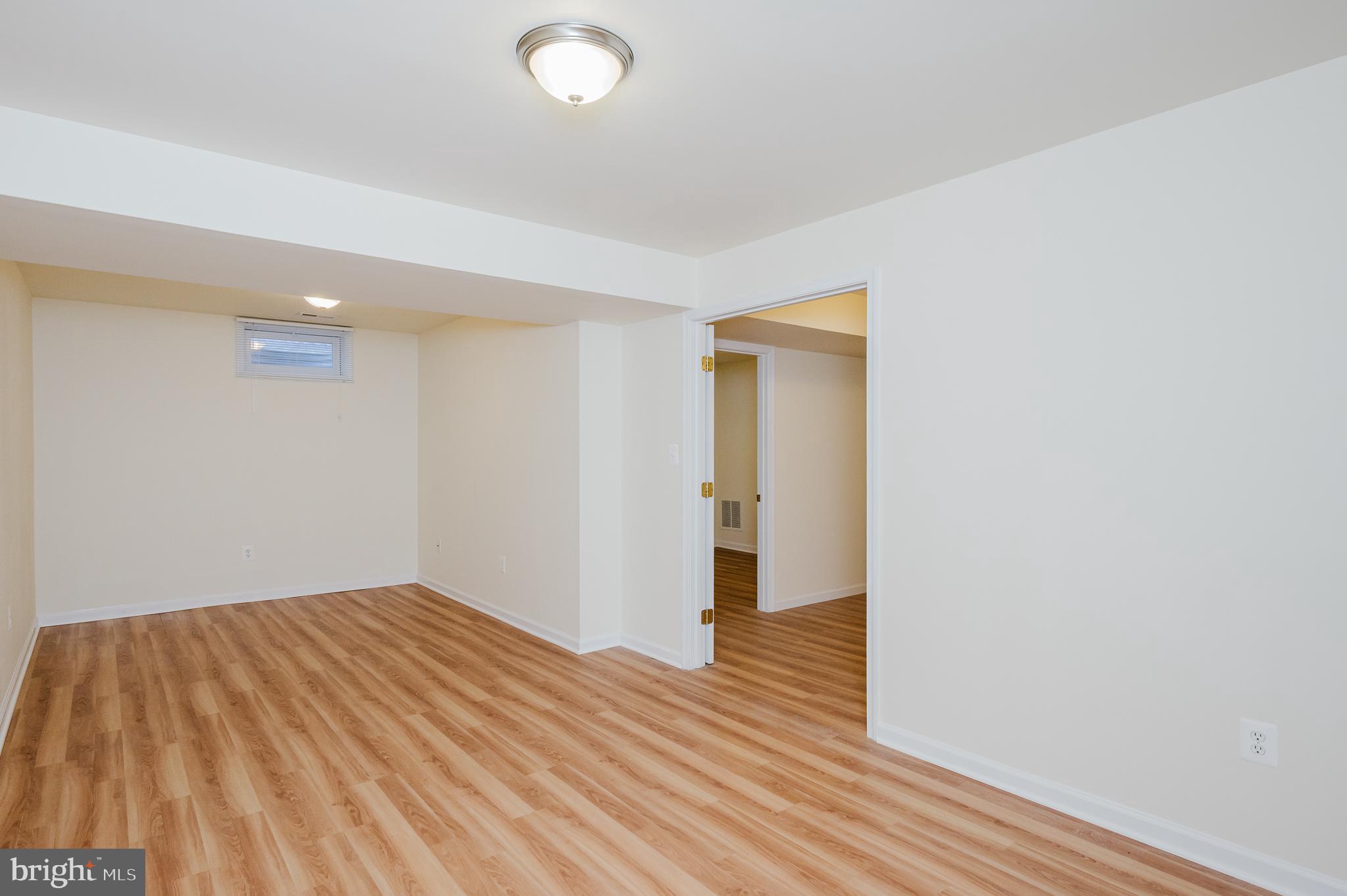 719 MacDill Road Middle River, MD 21220 - Photo 33 of 35 a view of a room with wooden floor and bathroom