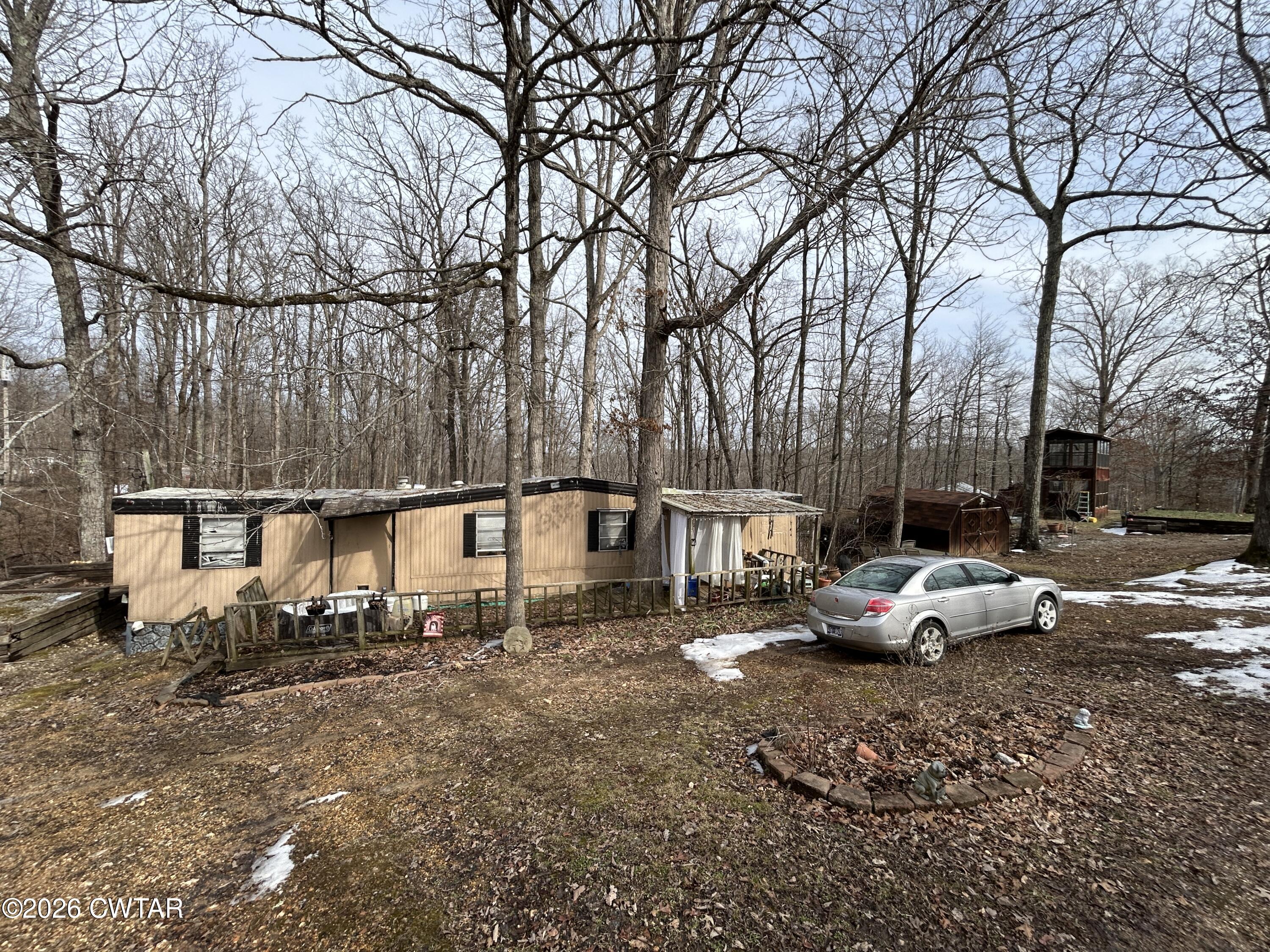 a row of parked cars parked in front of a house