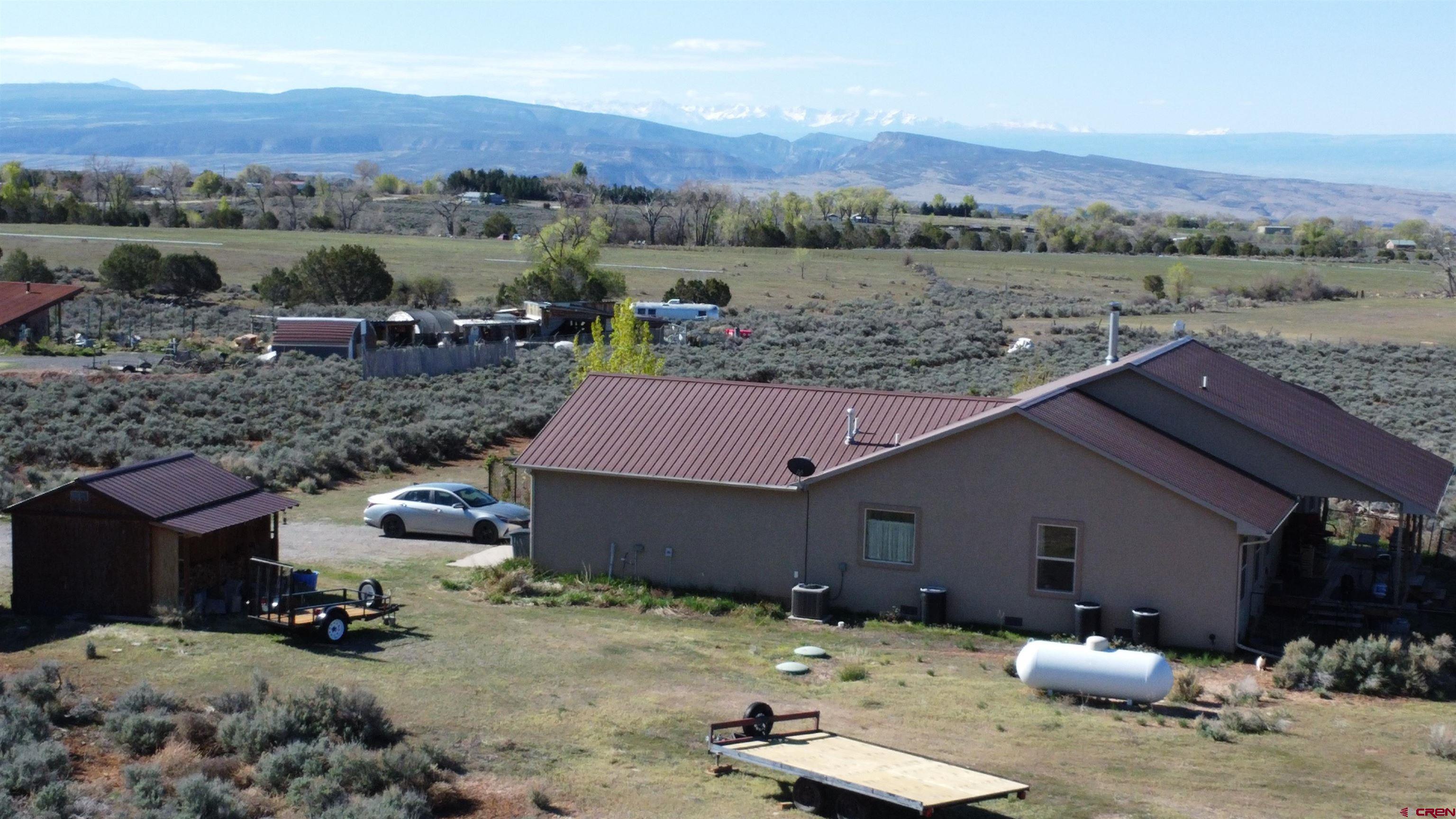 14617 2800th Road Hotchkiss, CO 81419 - Photo 12 of 37 an aerial view of a house with a yard