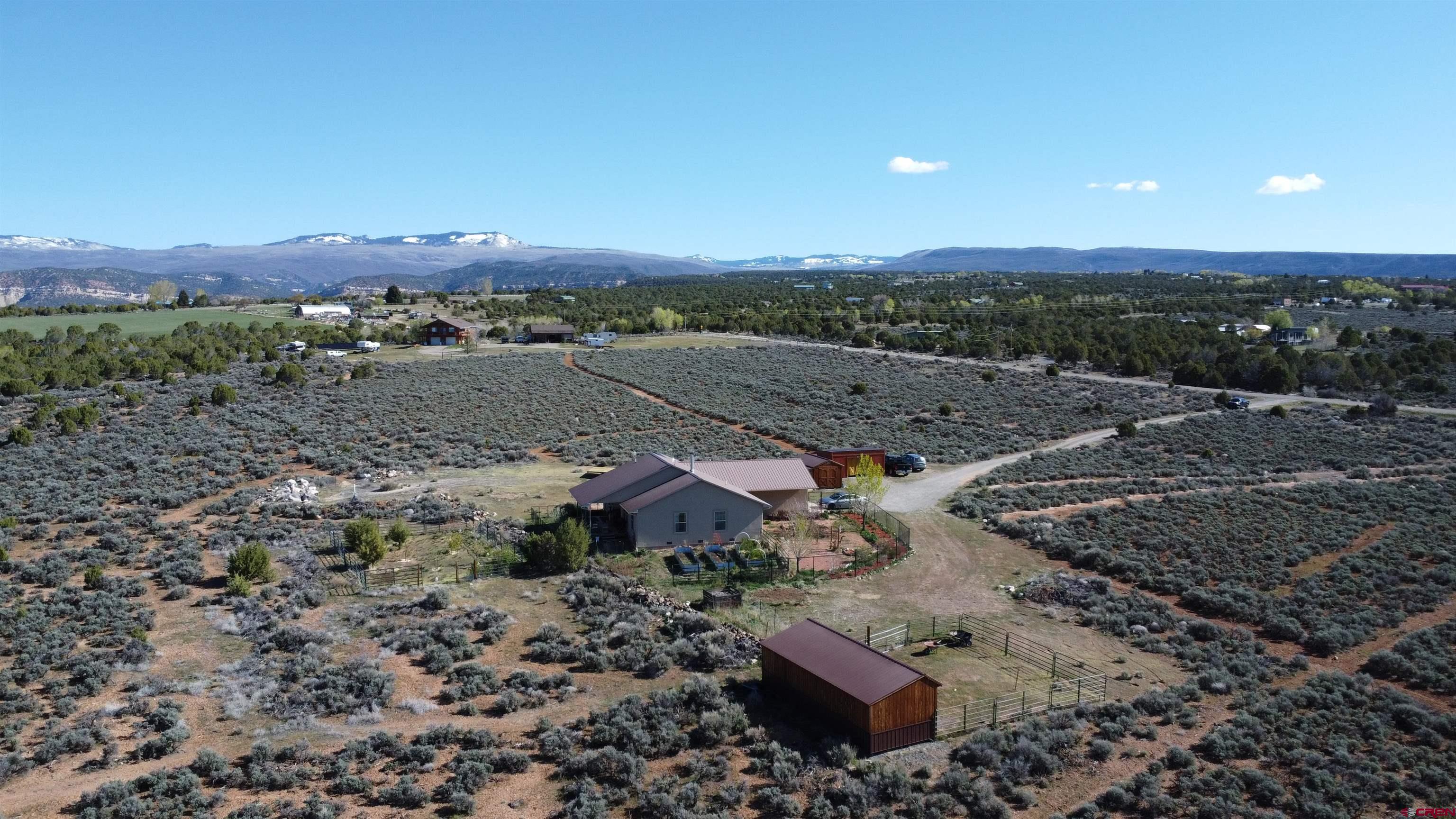 14617 2800th Road Hotchkiss, CO 81419 - Photo 13 of 37 an aerial view of a house with a yard