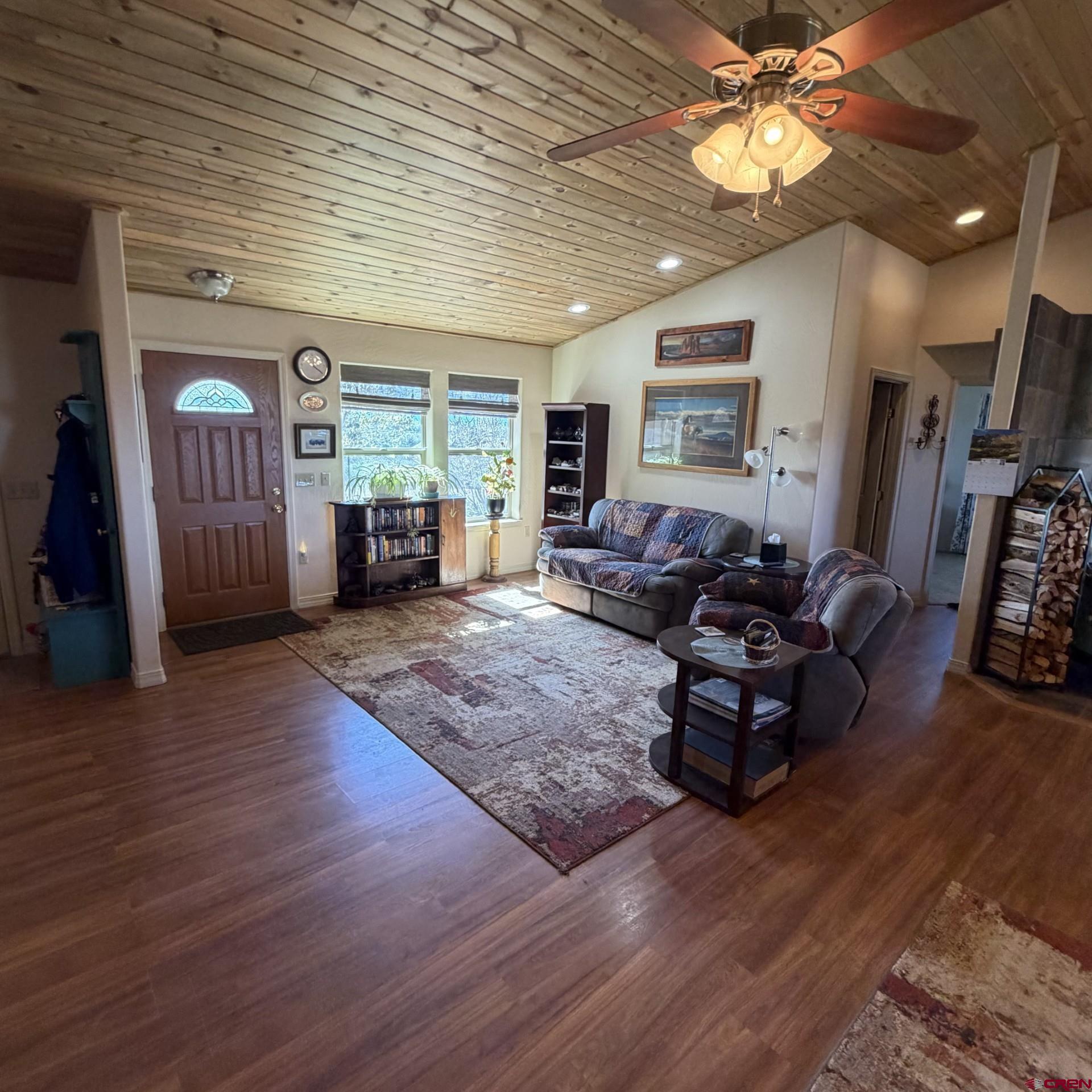 14617 2800th Road Hotchkiss, CO 81419 - Photo 16 of 37 a living room with furniture window and wooden floor