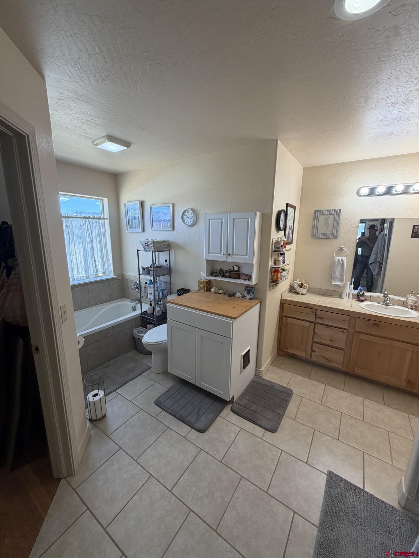 14617 2800th Road Hotchkiss, CO 81419 - Photo 25 of 37 a kitchen with a sink a counter top space and cabinets
