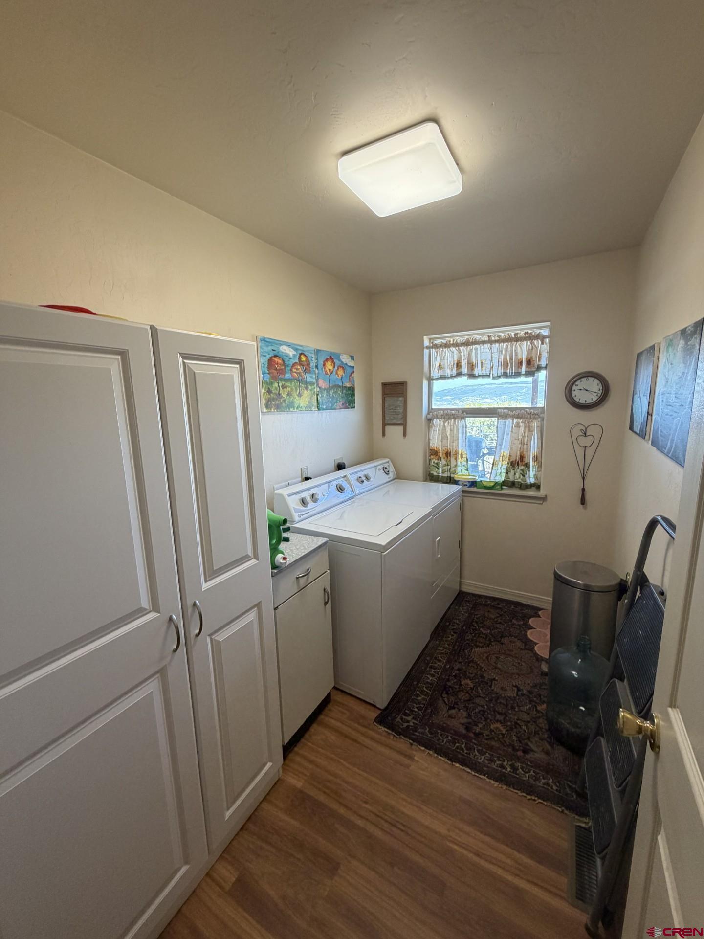 14617 2800th Road Hotchkiss, CO 81419 - Photo 30 of 37 a room with a window wooden floors and furniture
