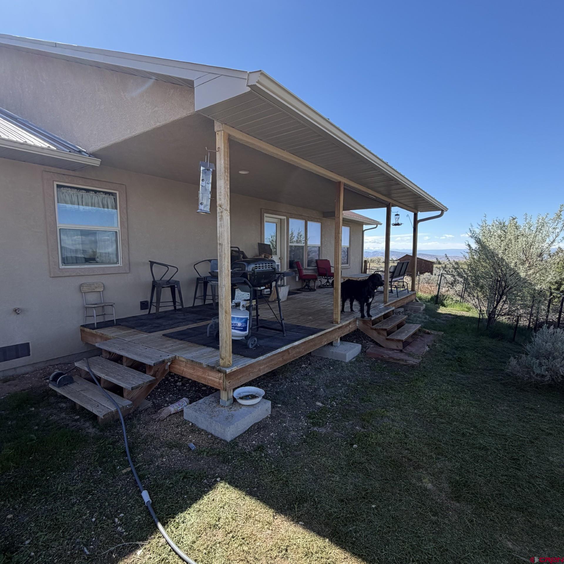 14617 2800th Road Hotchkiss, CO 81419 - Photo 31 of 37 a backyard of a house with outdoor seating