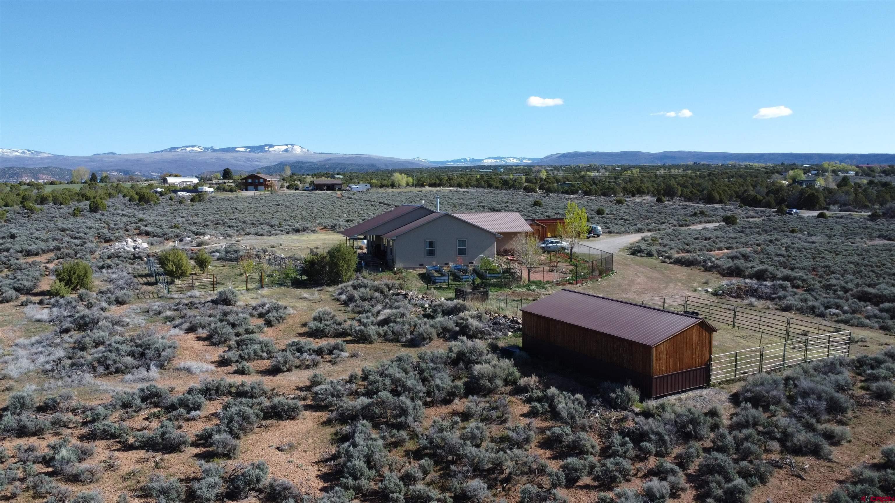 14617 2800th Road Hotchkiss, CO 81419 - Photo 35 of 37 an aerial view of a house with a yard