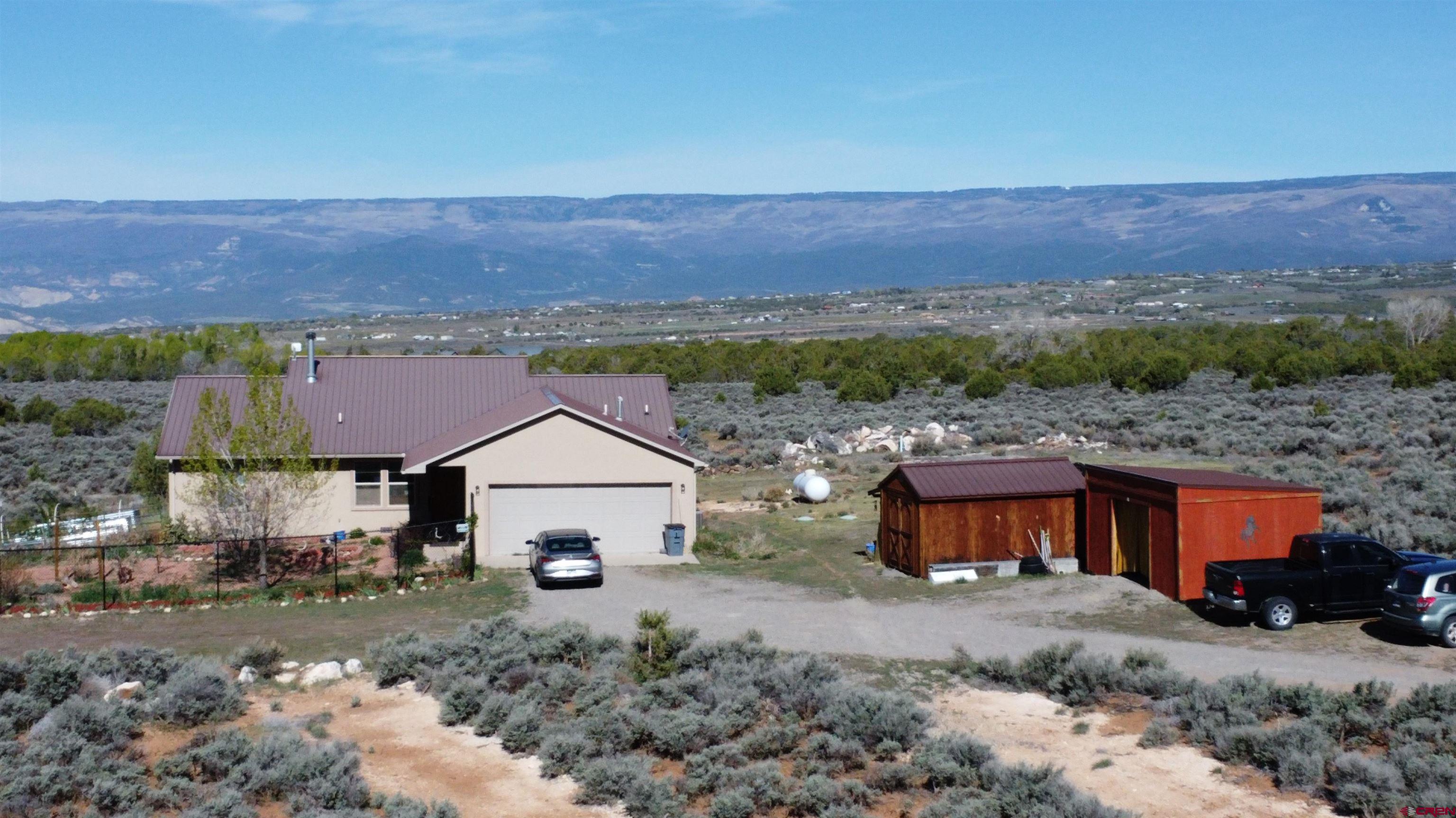 14617 2800th Road Hotchkiss, CO 81419 - Photo 37 of 37 a view of a house with a yard