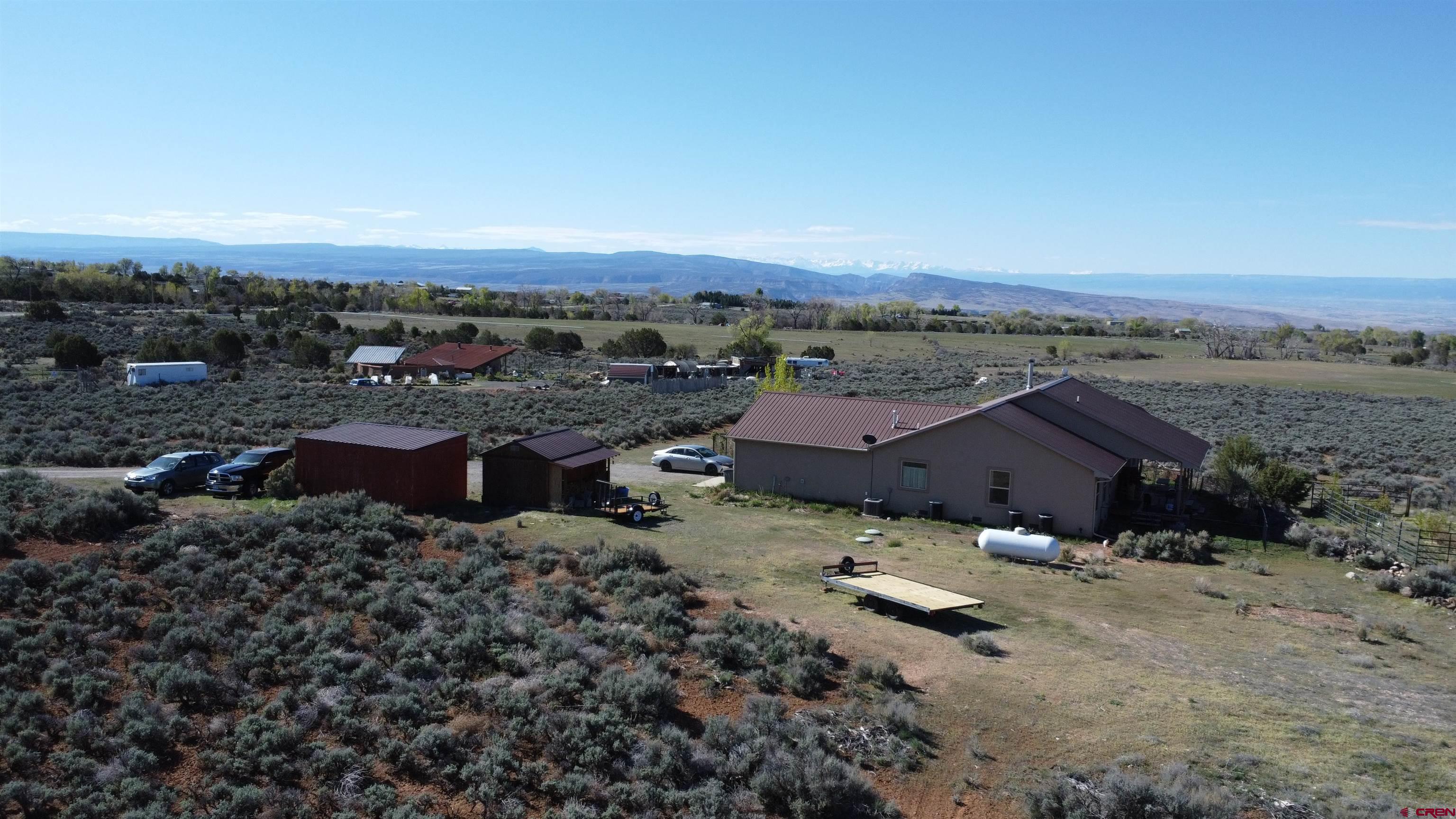 14617 2800th Road Hotchkiss, CO 81419 - Photo 6 of 37 an aerial view of multiple houses with a yard