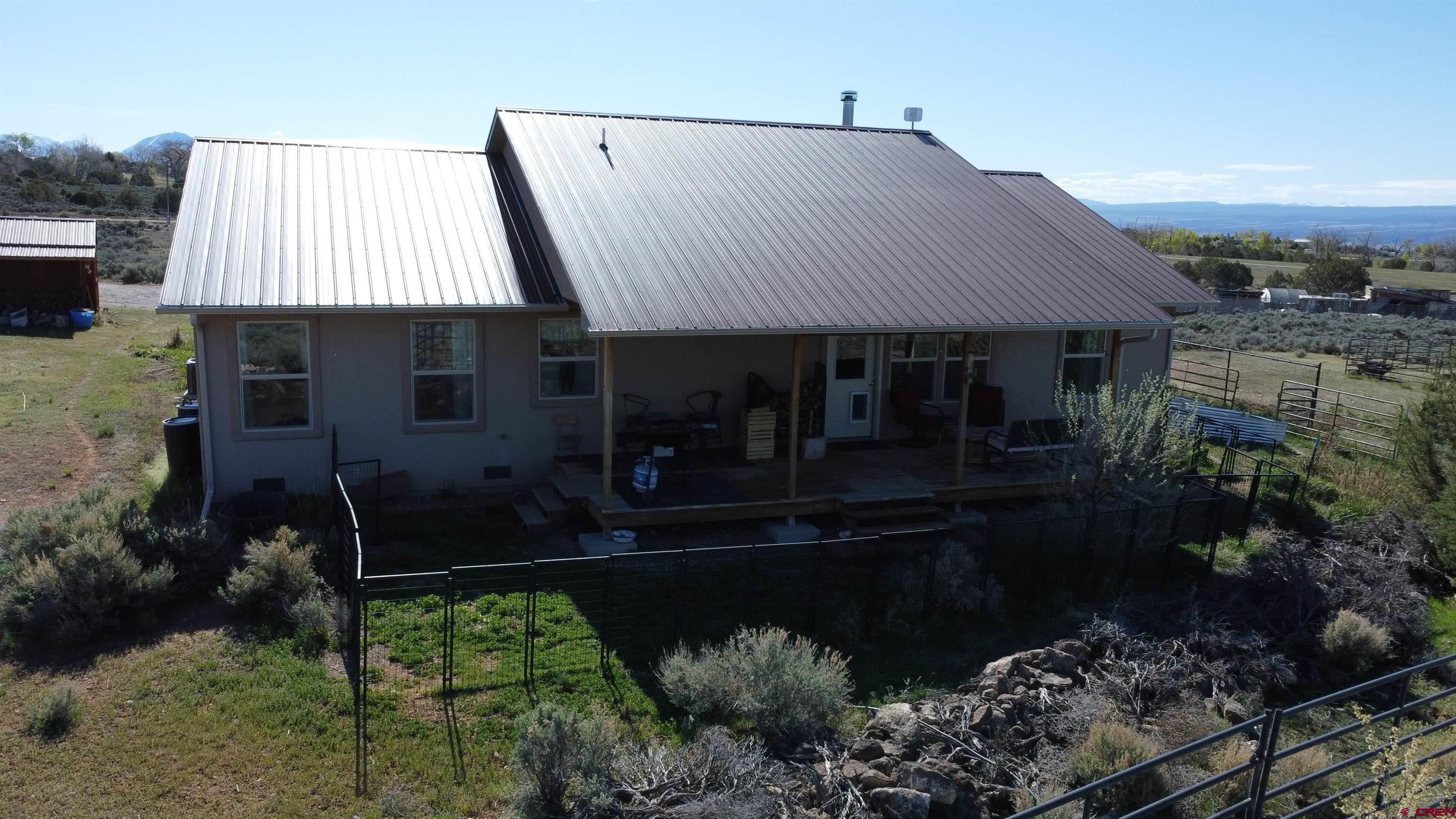 14617 2800th Road Hotchkiss, CO 81419 - Photo 7 of 37 a front view of house with yard and green space