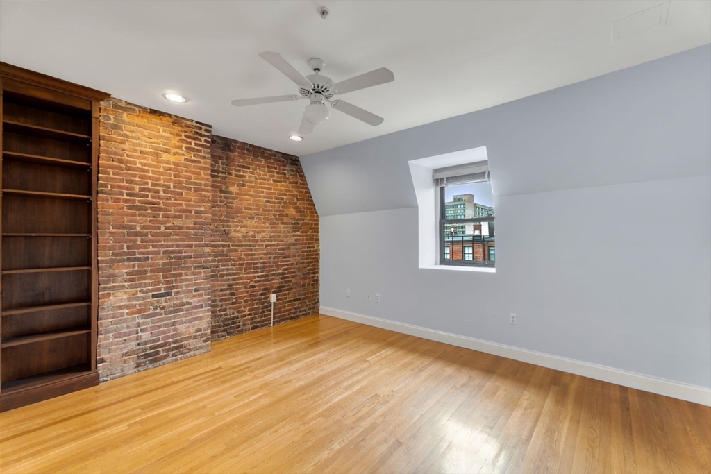 39 Worcester Square, Unit PH 5 Boston, MA 02118 - Photo 12 of 20 a view of an empty room and chandelier fan